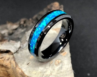 Black ceramic with blue opal ring