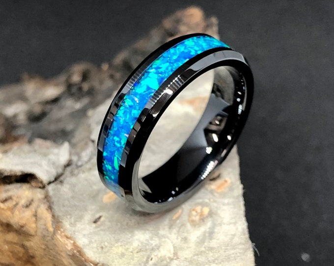 Black ceramic with blue opal ring