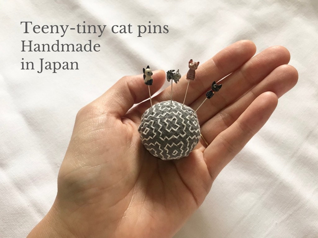 Teeny-tiny cat pins handmade in Japan