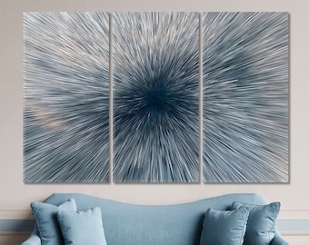 May include: A three-piece abstract art print set featuring a blue and white radial design. The design resembles a burst of light or a starburst.