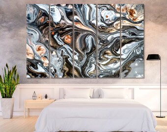 May include: Abstract art print with a multi-panel design. The print features swirling patterns of black, white, and gold paint.