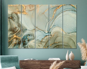 May include: Abstract wall art print featuring a multi-panel design with swirling blue and green hues and gold accents. The artwork is displayed on a wall in a living room setting.