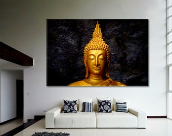 May include: A golden Buddha statue with closed eyes and a serene expression, set against a dark, textured background.