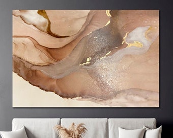 May include: Abstract art print with brown, beige, and gold colors. The print features swirling, flowing lines and a glittery texture.