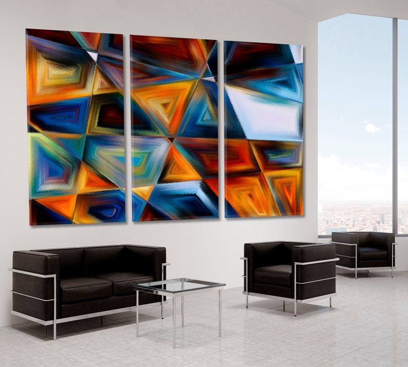 May include: Abstract art print with a geometric design in shades of blue, orange, and yellow. The print is divided into three panels.