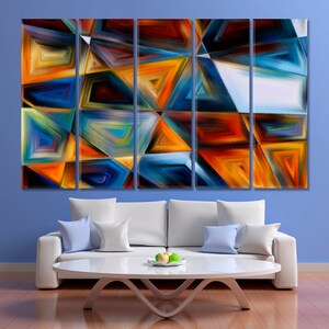 May include: Abstract art print with a multi-panel design. The print features a geometric pattern of triangles in shades of blue, orange, yellow, and red.