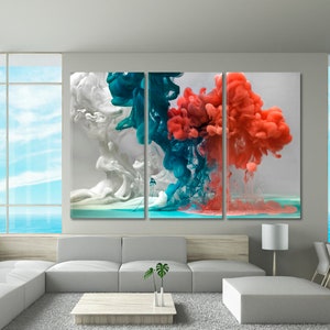 May include: A three-panel abstract art print featuring colorful ink swirls in shades of white, teal, and coral. The swirls appear to be floating in a clear liquid.