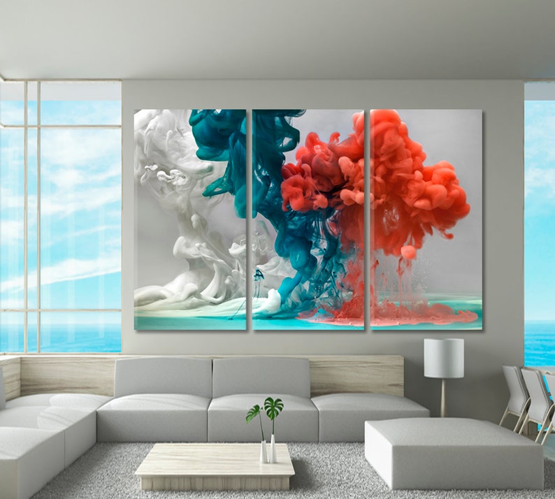 May include: A three-panel abstract art print featuring colorful ink swirls in shades of white, teal, and coral. The swirls appear to be floating in a clear liquid.