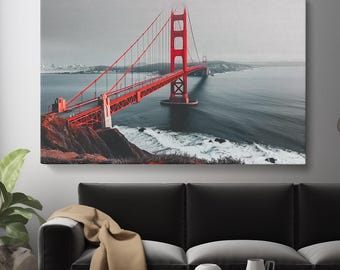 May include: A red suspension bridge with a view of the ocean and a foggy sky. The bridge is a popular landmark in San Francisco, California.