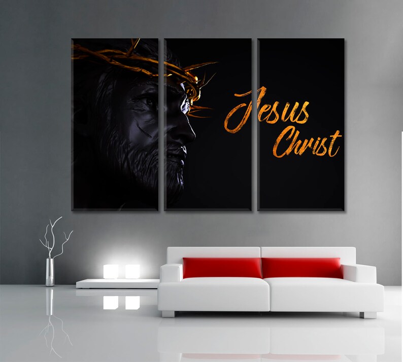 May include: A three-panel canvas print featuring a black and white image of Jesus Christ with a crown of thorns. The text "Jesus Christ" is written in gold script on the right panel.