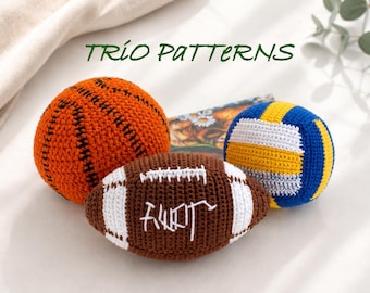 May include: Three crocheted sports balls including an orange basketball with black stitching, a brown football with white laces and stitching, and a blue, yellow, and white volleyball. The text TRIO PATTERNS is visible at the top of the image.