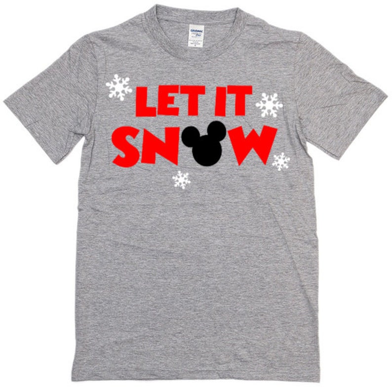 May include: A gray t-shirt with the text "Let It Snow" in red letters and a black Mickey Mouse head in the middle of the word "Snow".