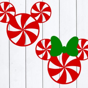May include: Two red and white peppermint candy cane Mickey Mouse silhouettes. The Mickey Mouse on the left has two ears and a large centre circle. The Mickey Mouse on the right has two ears, a bow, and a large centre circle.