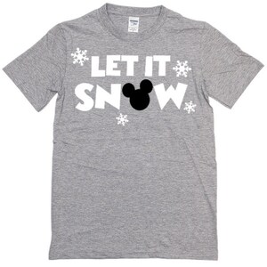 May include: A gray t-shirt with the text "Let It Snow" in white letters and a black Mickey Mouse silhouette. There are white snowflake designs around the text.