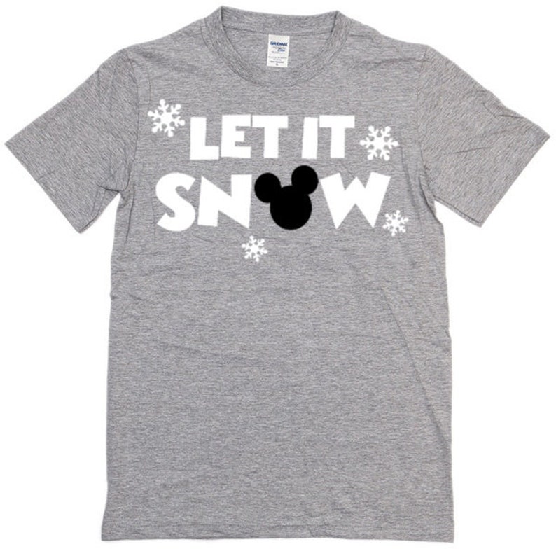 May include: A gray t-shirt with the text "Let It Snow" in white letters and a black Mickey Mouse silhouette. There are white snowflake designs around the text.