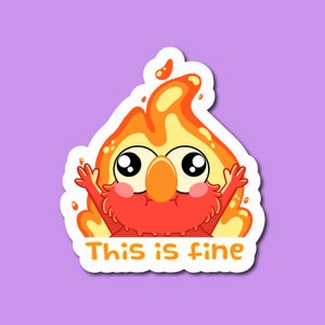 Op de afbeelding: Een cartoon sticker van een rood en oranje vuurkarakter met grote ogen en de tekst "This is fine".