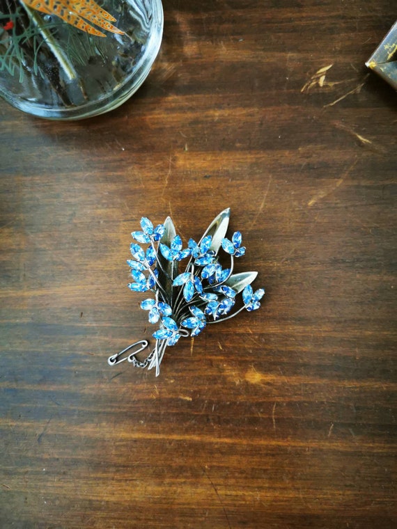 1960s Donald Simpson crystal blue bell brooch