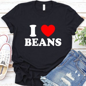 May include: Black t-shirt with white text that says "I love beans" and a red heart.