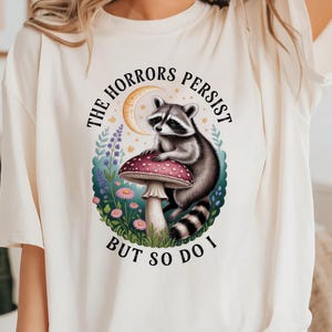 Funny Raccoon Mental Health Meme Shirt - The Horrors Persist