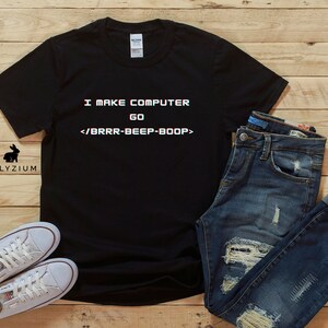May include: Black t-shirt with white text that reads "I MAKE COMPUTER GO </BRRR-BEEP-BOOP>"