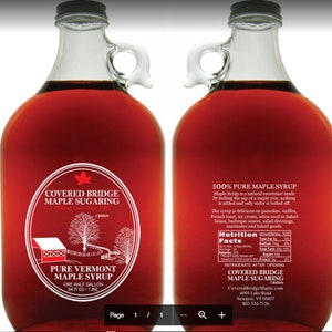 May include: A glass jug of pure Vermont maple syrup with a red label that says "Covered Bridge Maple Sugaring" and a picture of a red covered bridge. The label also says "One Half Gallon 64 Fl Oz - 1.89L".