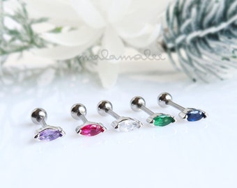 May include: Five silver-toned ear piercing studs with marquise-cut gemstones in purple, pink, clear, green, and blue. The studs have a small ball on one end and a flat, marquise-shaped gem on the other.