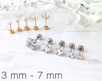 May include: A set of 10 clear cubic zirconia stud earrings in silver and gold settings. The earrings are available in sizes from 3mm to 7mm.