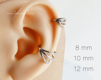 May include: Silver triple hoop earring for a helix piercing. The earring is available in three sizes: 8 mm, 10 mm, and 12 mm.
