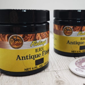 May include: Two jars of Fiebing's Black Antique Finish leather dye. Each jar contains 4 fluid ounces (118 ml) of dye.
