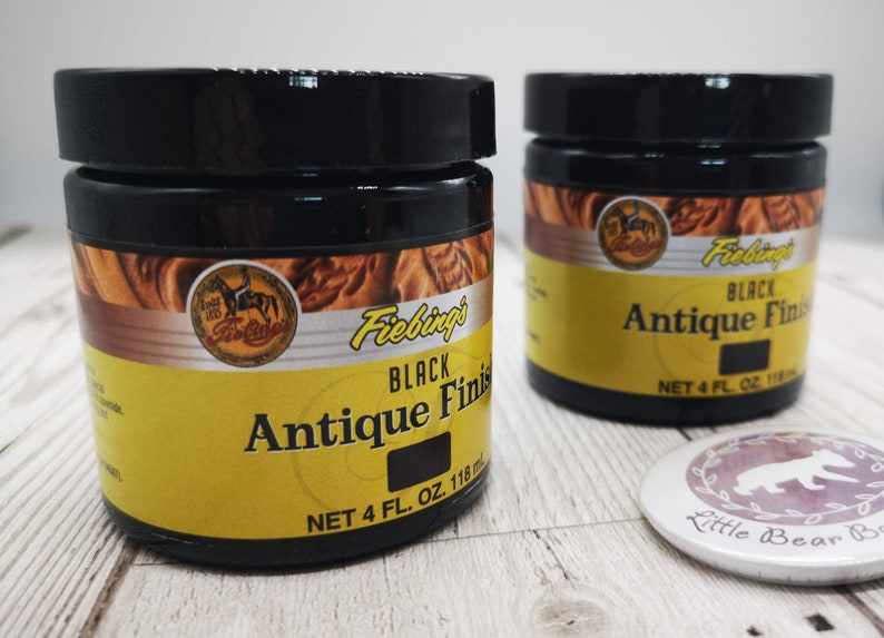 May include: Two jars of Fiebing's Black Antique Finish leather dye. Each jar contains 4 fluid ounces (118 ml) of dye.