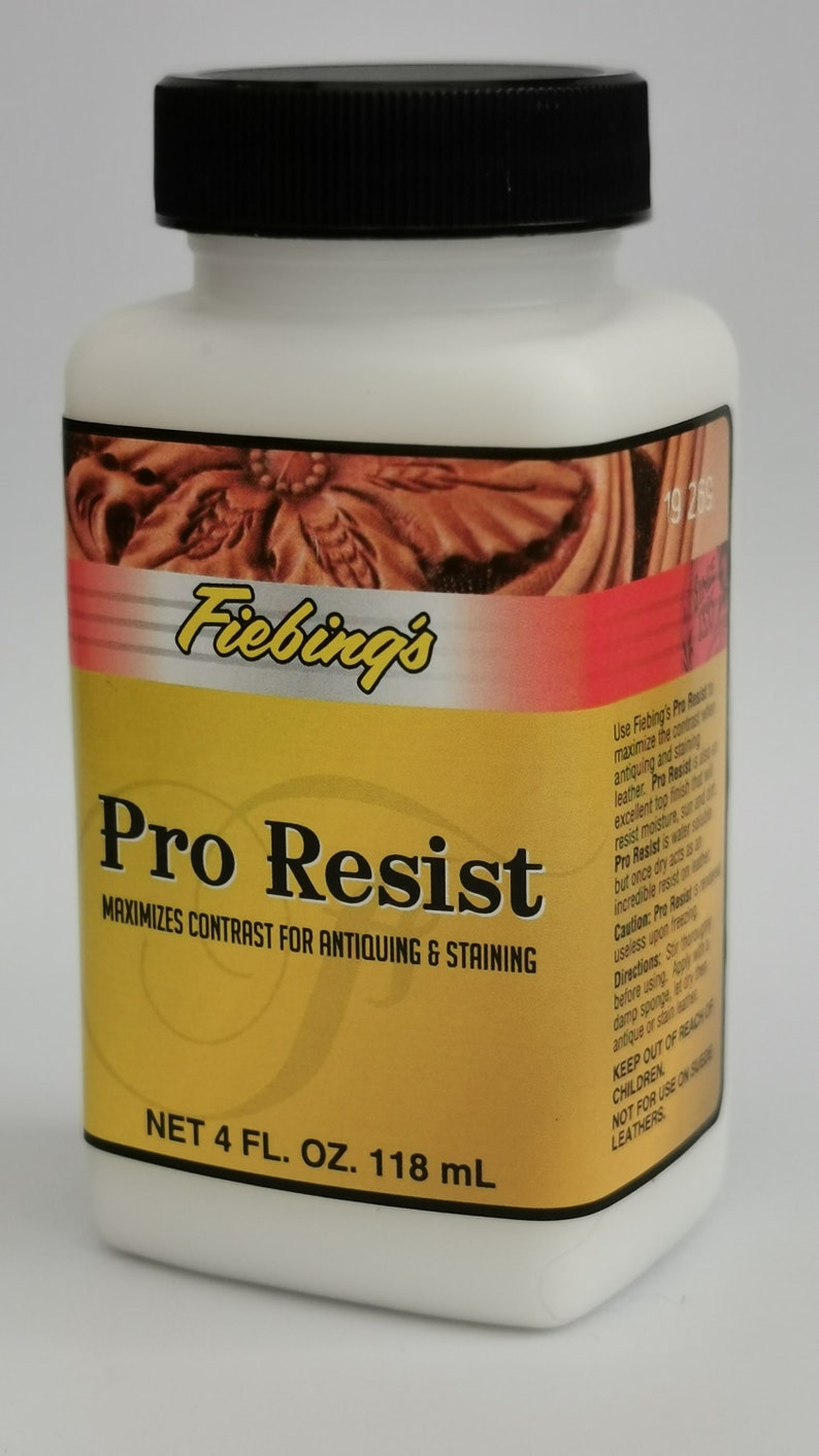 May include: A white plastic bottle with a black cap, labeled "Fiebing's Pro Resist." The label is yellow and red, with text indicating it maximizes contrast for antiquing and staining. Contains 4 fl oz (118 mL).
