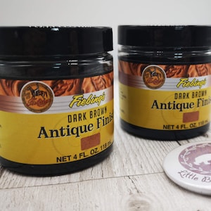 May include: Two bottles of Fiebing's Dark Brown Antique Finish leather dye. Each bottle contains 4 fluid ounces (118 ml).