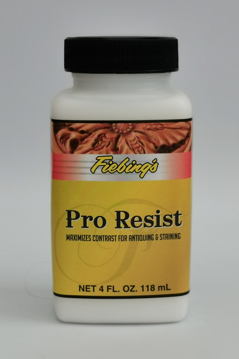 May include: A white plastic bottle with a black cap, labeled "Fiebing's Pro Resist." The label is yellow and red, with text indicating it maximizes contrast for antiquing and staining. The bottle contains 4 fl. oz. or 118 mL.