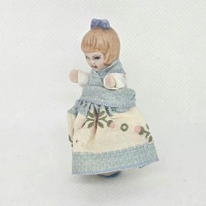 Antique miniature bisque doll.