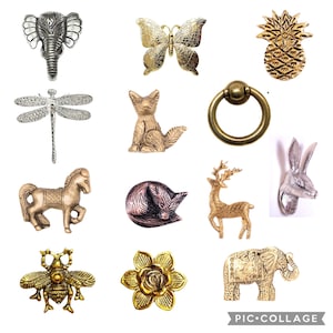 May include: A collection of 12 decorative metal animal figurines, including a dragonfly, a deer, a fox, a pineapple, a bee, a flower, an elephant, a rabbit, a horse, and a butterfly. The figurines are made of gold, silver, and bronze metal.
