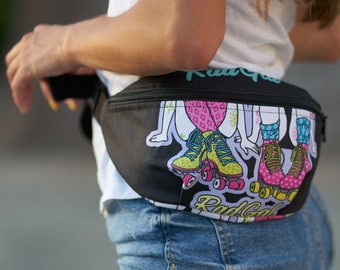 May include: A black fanny pack with a colorful graphic of roller skaters. The text "Rad Girl" is printed on the pack.