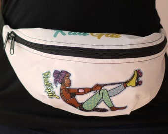 May include: White fanny pack with a black zipper and a colorful illustration of a woman roller skating. The text "Rad Gal" is printed on the pack.