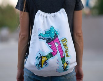 May include: White drawstring bag with a colorful illustration of a person roller skating. The illustration includes pink tights, blue roller skates, and the text "Rad Goal".