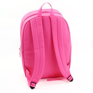 May include: A bright pink backpack with adjustable straps and a zipper closure. The backpack is made of a durable fabric and has a spacious main compartment.