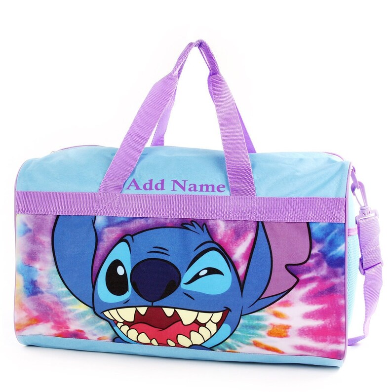 May include: A blue and purple duffel bag with a tie-dye pattern and a cartoon Stitch character on the front. The bag has a purple handle and a purple strap. The text "Add Name" is printed on the bag.