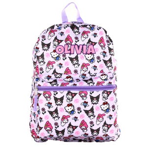 May include: A light purple backpack with a repeating pattern of cartoon characters, flowers, and other designs. The backpack has a front zippered pocket, a top handle, and the name "OLIVIA" in pink letters.