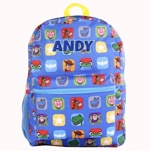 May include: Blue backpack featuring characters from Toy Story, with the name "ANDY" in large letters. The backpack has a yellow handle and a blue mesh side pocket. The front pocket has a blue zipper.