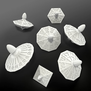 May include: Six white tabletop game pieces, including a square, a hexagon, and four spinning tops. The tops have numbers 1-20 around the edge and a pointed top.