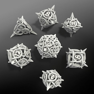 May include: Set of seven white dice with intricate designs and numbers. The dice are made of a hard plastic material and have a matte finish.
