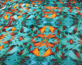 May include: A roll of fabric with a vibrant abstract design. The pattern features teal, orange, and red brushstroke-like shapes. The fabric is labeled "SYMMETRIA TEXTILE PRINT DESIGN".
