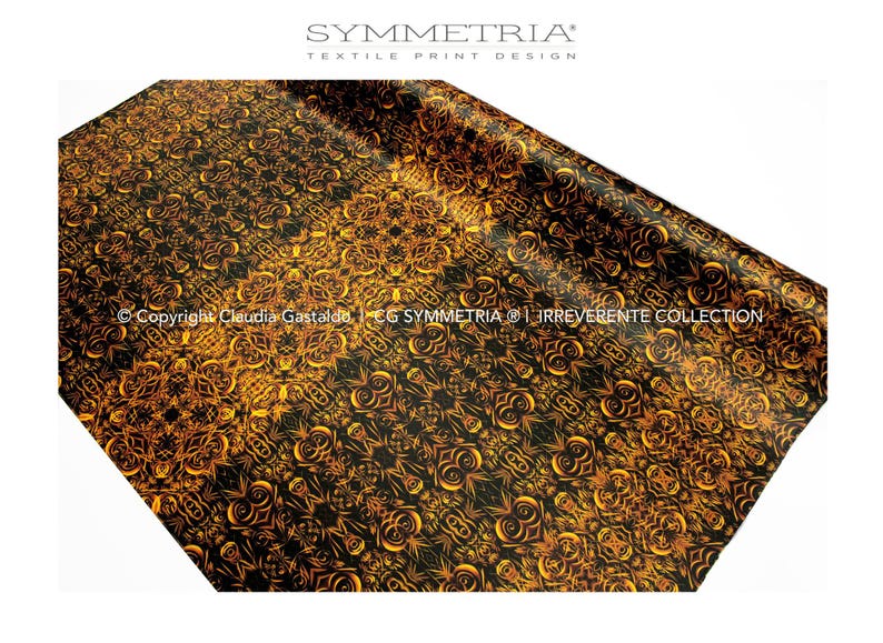 May include: A black and gold textile print with an intricate, symmetrical pattern. The design features swirling, floral-like motifs in shades of gold against a black background. The image includes the text "SYMMETRIA TEXTILE PRINT DESIGN".