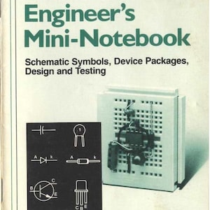 May include: A green and white book titled "Engineer's Mini-Notebook" by Forrest M. Mims III. The book cover features a schematic diagram of an electronic circuit and the text "Schematic Symbols, Device Packages, Design and Testing". The book is published by Radio Shack.