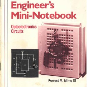 May include: A book titled "Engineer's Mini-Notebook: Optoelectronics Circuits" by Forrest M. Mims III. The book cover features a red and white design with the text "Radio Shack" and "ARCHER" in white. The book cover also includes a diagram of an electronic circuit and a photo of a breadboard with electronic components.