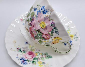 Royal Doulton Arcadia teacup and saucer , swirl design , florals , bone china made in England