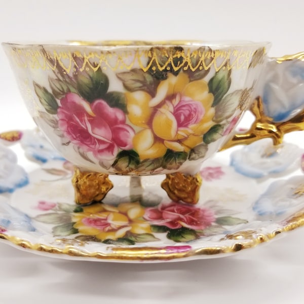 Castle Japan handpainted teacup and saucer, flower handle, footed, flower shaped three feet, roses, vintage china